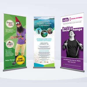 Display of three pull up banners: Compost Rocks - One Story, Sustainable Island Conference and Social Futures